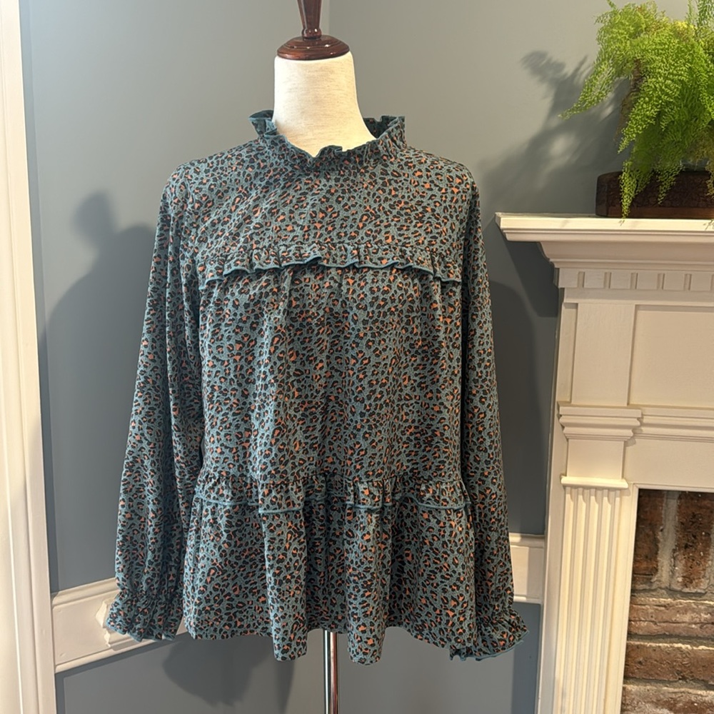 And the why teal leopard blouse